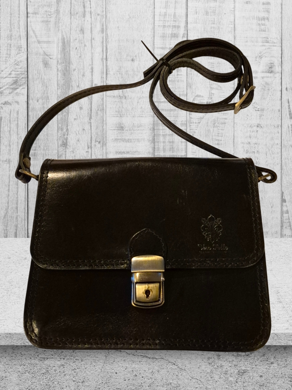 Vera Pelle Black Leather Crossbody with Brass Clasp
